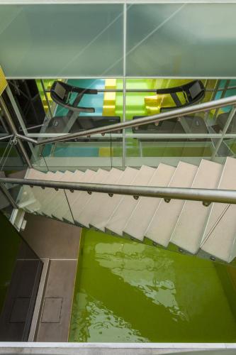 a staircase in a building with a pool of water at Hotel Unique in Sao Paulo