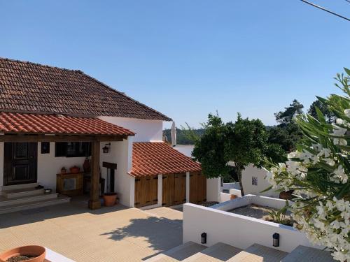 a house with a swimming pool in the yard at Casa Da Oliveira in Pedrógão Grande