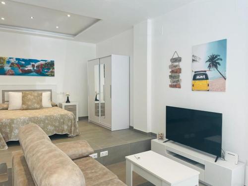 Posteľ alebo postele v izbe v ubytovaní Apartamento Alhucemas Playa