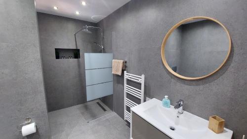 a bathroom with a sink and a mirror at Jimmy's place in Artemida