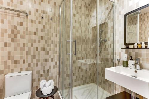 a bathroom with a shower and a toilet and a sink at Sweet Inn - Ausias Marc in Barcelona