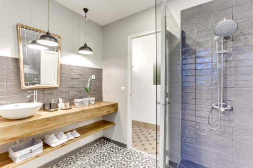 a bathroom with a sink and a shower at Sweett - Aragon in Barcelona