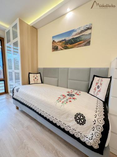 a bedroom with a bed in a room at Willa Michałówka in Zakopane