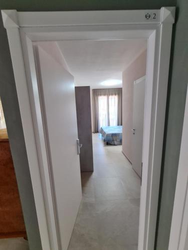 Ένα ή περισσότερα κρεβάτια σε δωμάτιο στο Il Risveglio di Pula Domo
