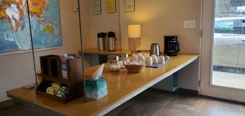 a counter in a room with a table with cups on it at Sequoia Resort in Badger