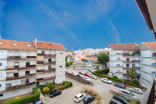 arial view of a parking lot in a city at CQ Coimbra in Coimbra
