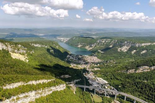 an aerial view of a bridge over a river at Joli appartement en face de lac in Nantua