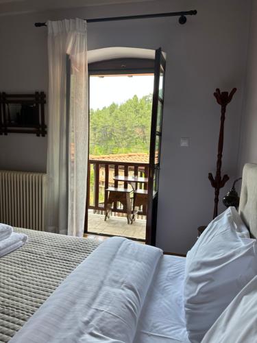 A bed or beds in a room at ΔΗΜΗΤΣΑΝΑΣ ΤΟΠΟΣ Νύμφη Αγνώ