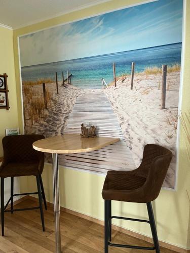 a painting of a boardwalk to the beach at Ferienwohnung Haus Rügen in Göhren