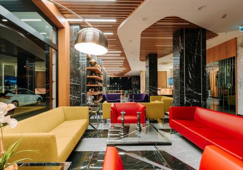 a lobby with couches and chairs in a building at Invite Hotel Corner Trabzon in Trabzon