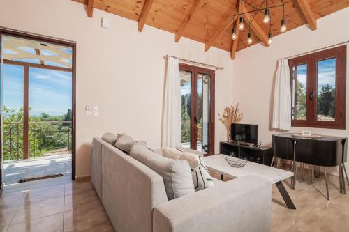 Χώρος καθιστικού στο Vozas Villas - Traditional Houses with Great View