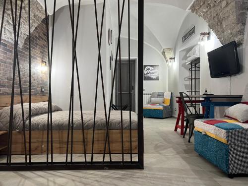 Tempat tidur dalam kamar di Coccia resort / Norcia centro