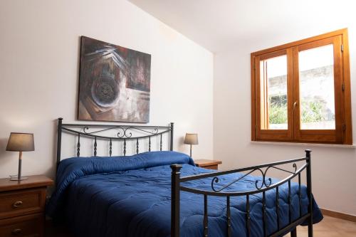 Postel nebo postele na pokoji v ubytování Casa Laura di fronte la Tonnara