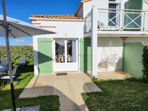 Photo de la galerie de l'établissement Maison Les Dunes avec piscine collective, à La Faute-sur-Mer