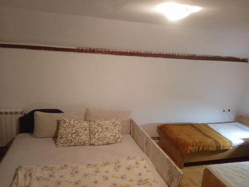 a small room with a bed and a mattress at Villa Natalija in Podgorica