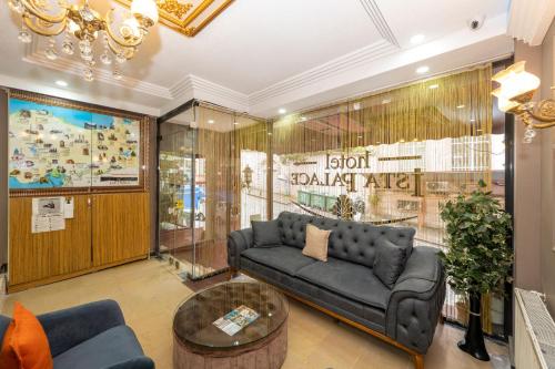 a living room with a couch and a table at Ista Palace Hotel in Istanbul