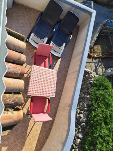 an overhead view of a table and chairs on a patio at Holiday Home Pernat in Valun