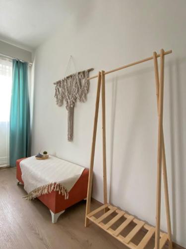 a bedroom with a bed and a cross on the wall at Lemon-Ada Butik Otel in Kusadası
