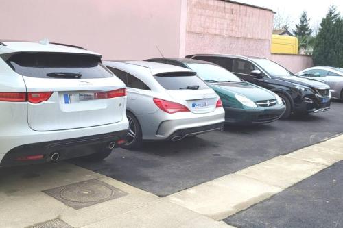 a row of parked cars in a parking lot at Studio cosy proche Paris Orly in Morangis
