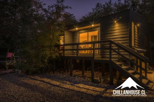 a cabin at night with the lights on at Chillán House in Las Trancas