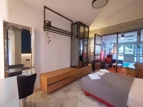 a room with a desk and a table in a room at Υ27 Modern Design Studio in Mytilini