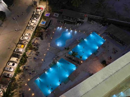 an overhead view of a pool with blue lights at Reserva del Mar - Apto con vista al mar in Santa Marta