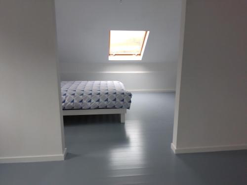 a white room with a bench with a window at Cornacarta Holiday House in Boyle