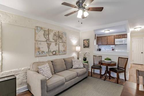 a living room with a couch and a table at The Flats on Florida St - Super Comfy 2-Bedroom Apartments in Mobile