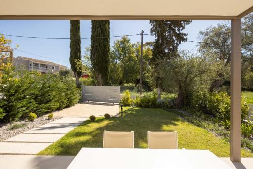 a view of a garden from the patio of a house at Stablo Residence in Kanálion
