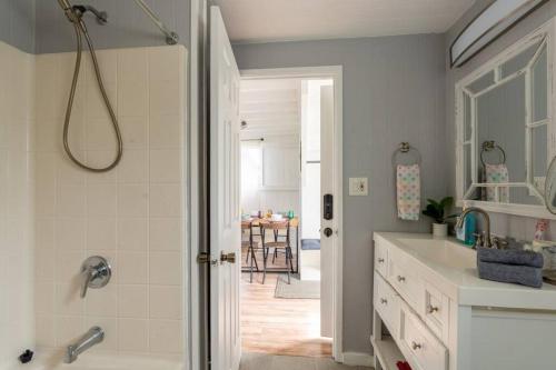 a bathroom with a shower and a sink at Somewhere over the Rainbow Loft with AC Hilo in Hilo