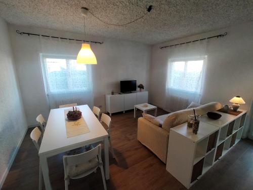 a living room with a couch and a table at stella marina in Porto Recanati