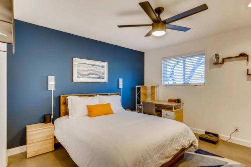 a bedroom with a bed and a ceiling fan at Modern Designer Condo Close to Downtown Austin! in Austin