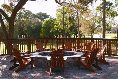 a group of chairs and a fire pit on a patio at Innisbrook Resort in Palm Harbor