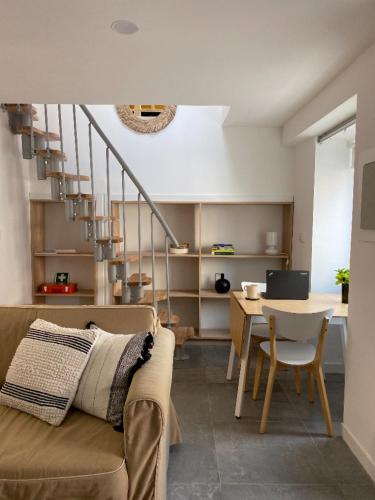 a living room with a couch and a table at Beach & City - Trafaria in Trafaria