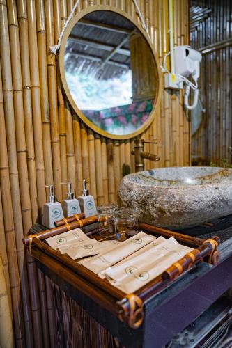 a bathroom with a sink and a mirror at Fairy Mountain Retreat in Ninh Binh