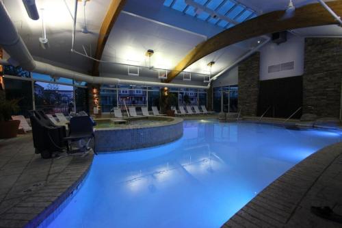 a swimming pool with blue lights in a hotel at 1B/1B condo with Ocean views, Resort style, Free WIFI, Few steps to the Beach!! in Wildwood Crest