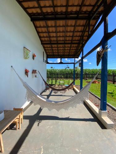 a hammock room with a view of a vineyard at Jardim D’Jully in Santa Terezinha de Itaipu