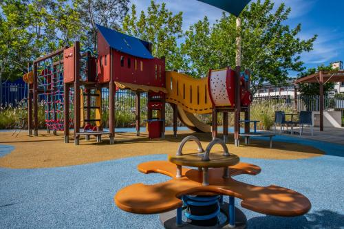 a playground with a slide in a park at Mercure Kooindah Waters Central Coast in Wyong