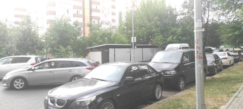 a bunch of cars parked on the side of a street at Brown Aparts in Chişinău