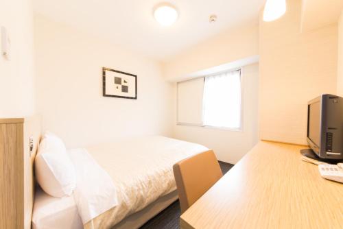 Postel nebo postele na pokoji v ubytování Hotel il Grande Umeda