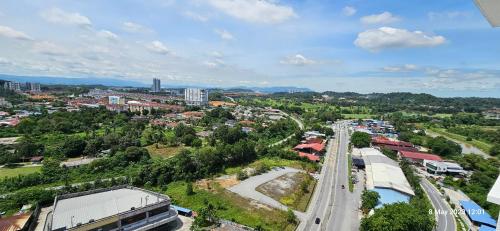 an overhead view of a city with a road and buildings at Mimpi Muji Homestay Vista Bangi in Kajang