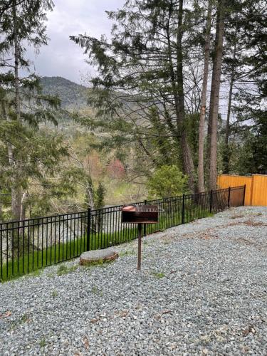 a grill sitting in front of a fence at The River House in Grants Pass