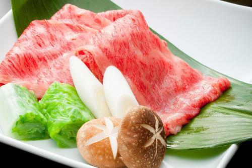 a plate of food with meat and vegetables on it at Kinzan in Kobe