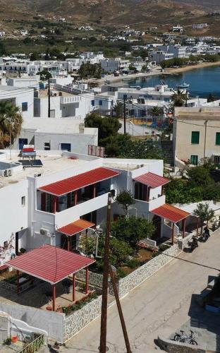 an aerial view of a city with white buildings at Helios Serifos in Livadion