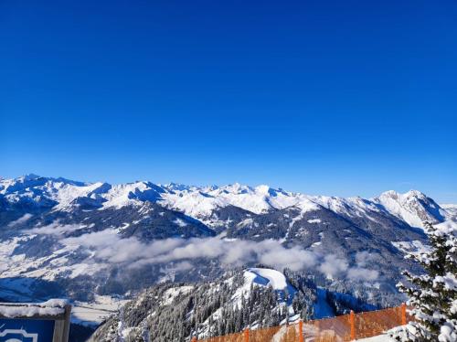 a view of the mountains from the top of a snow covered mountain at Good times @ Salzburg in Habach