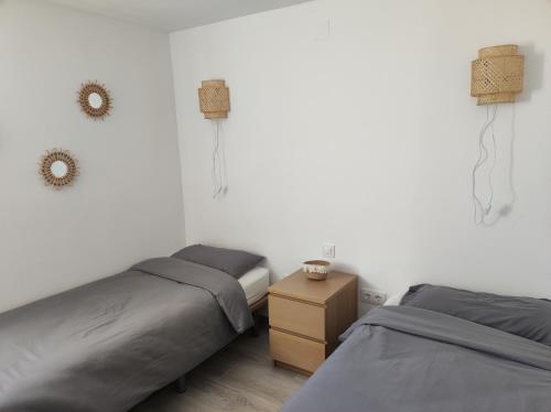 Postel nebo postele na pokoji v ubytování Privé vakantiewoning "Casa Stirio" met zwembad regio calpé-jalon