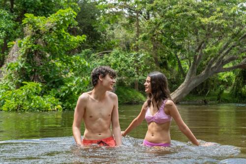 a man and a woman standing in the water at Koddu Kalpitiya in Kalpitiya
