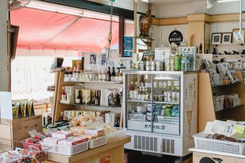 a shop with a lot of products on display at 自由自屋 in Nachikatsuura