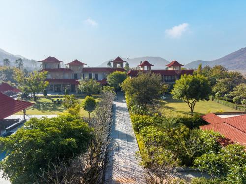 an aerial view of a resort with trees and buildings at Anandam - A Luxury Resort in Udaipur in Udaipur