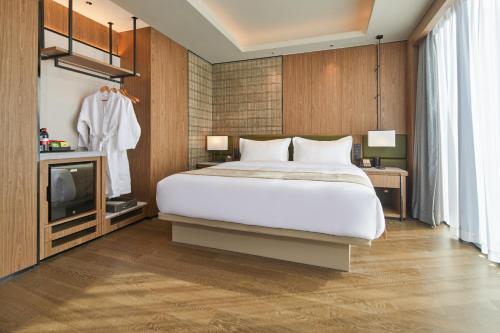 Postel nebo postele na pokoji v ubytování Dongguan Tangxia Huaman Hotel